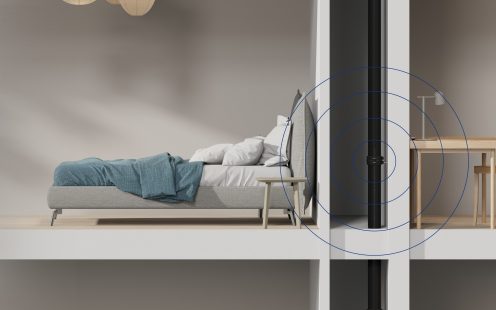 A visualization of an open wall in a multi-storey building, showing a Master3Plus soil stack installed in a wall that separates a bedroom and a home office | Pipelife