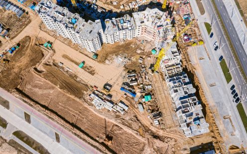 city construction site. new apartment buildings under construction. top view from drone
